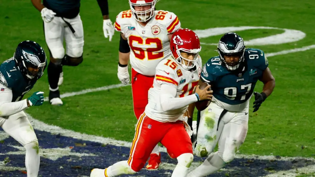 Kansas City Chiefs quarterback Patrick Mahomes scrambles against the Philadelphia Eagles during the fourth quarter in Super Bowl LVII
