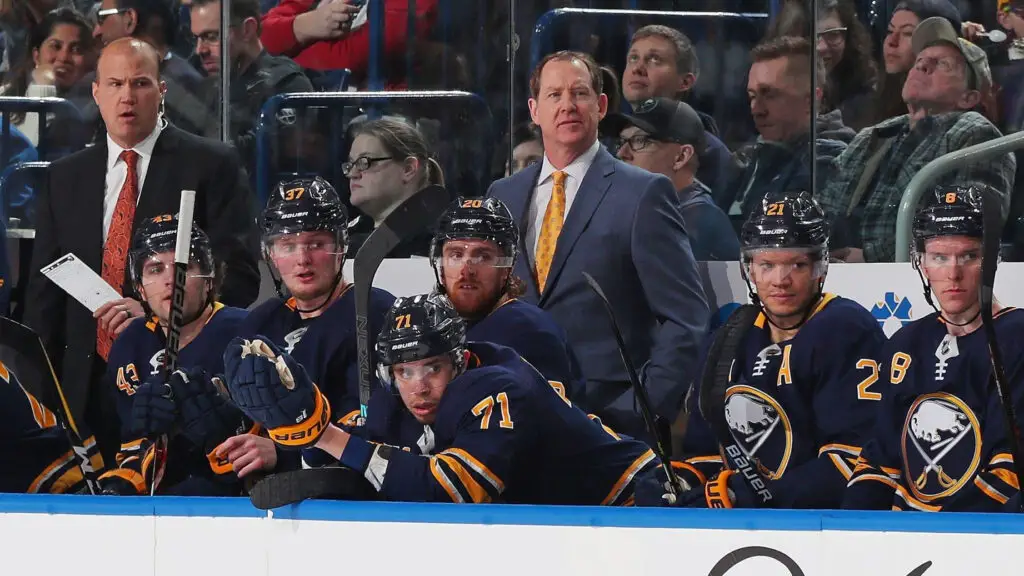 Former Buffalo Sabres Head Coach Phil Housley watches the action from the bench during an NHL game against the Columbus Blue Jackets