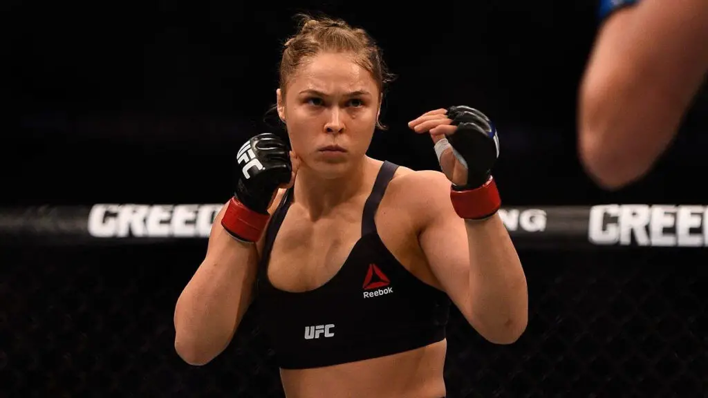 UFC fighter Ronda Rousey squares off against Holly Holm in their women’s bantamweight championship bout during the UFC 193 main event