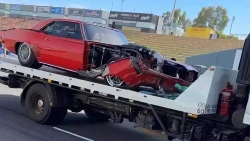 Street Outlaws star Ryan Martin's car on a flatbed after crashing during practice