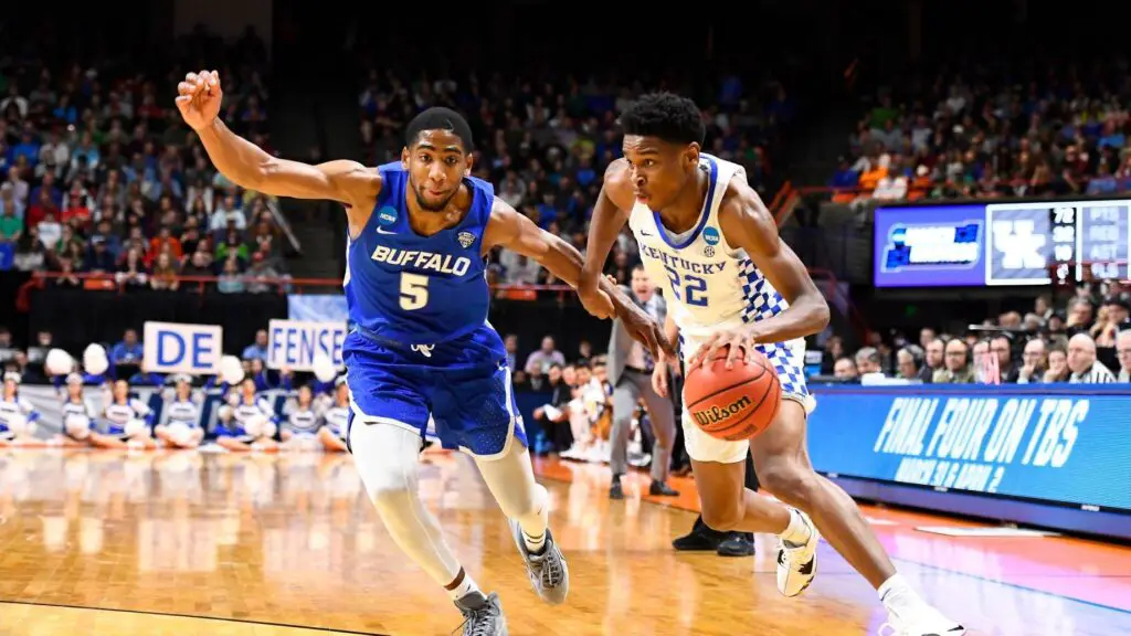 Kentucky Wildcats star Shai Gilgeous-Alexander drives to the basket as CJ Massinburg defends against the Buffalo Bulls in the second round of the 2018 NCAA Men’s Basketball Tournament