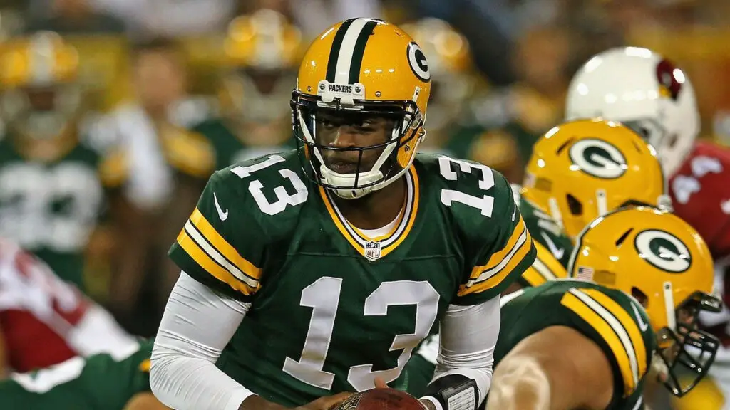 Former Green Bay Packers quarterback Vince Young turns to hand-off the football against the Arizona Cardinals