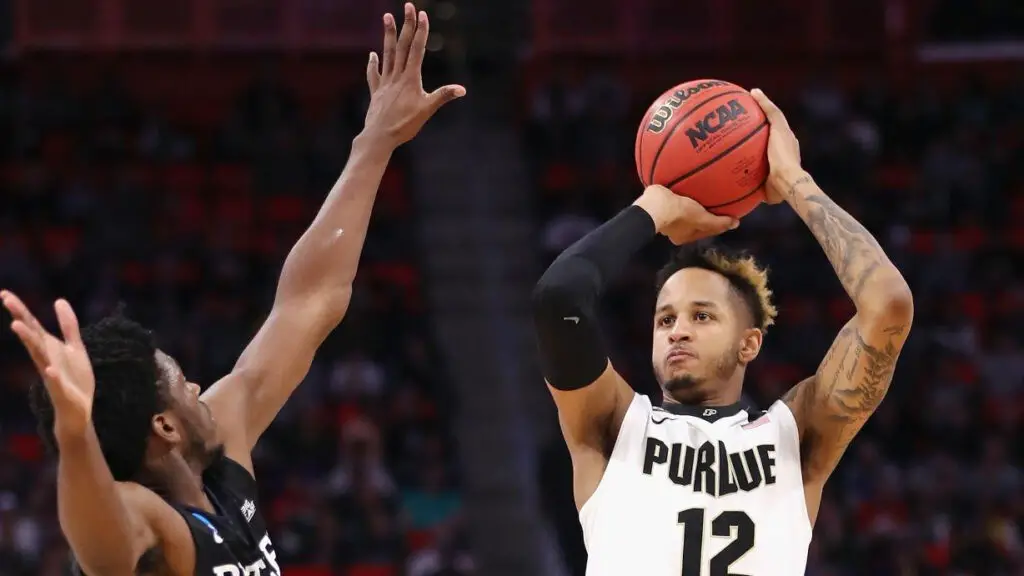 Purdue Boilermakers player Vincent Edwards shoots the ball as Kamar Baldwin defends against him against the Butler Bulldogs during the second half in the second round of the 2018 NCAA Men's Basketball Tournament