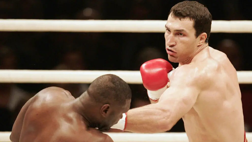 Boxer Wladimir Klitschko throws a punch against Ray Austin during their IBO and IBF World Heavyweight Championship fight