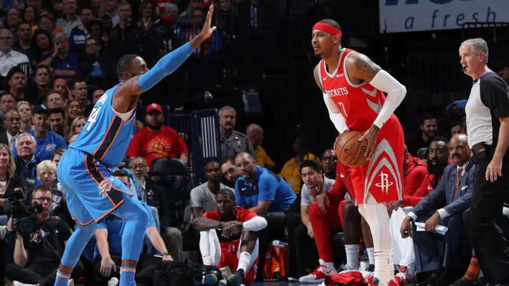 Houston Rockets player Carmelo Anthony looks to pass the ball during the game against the Oklahoma City Thunder