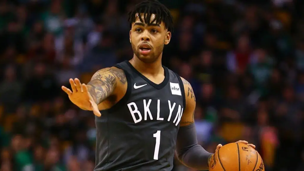 Brooklyn Nets star D'Angelo Russell dribbles the ball during a game against the Boston Celtics