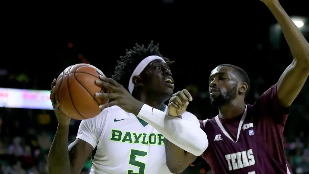 Baylor Bears player Johnathan Motley drives to the basket as he is being defended by Marvin Jones against the Texas Southern Tigers in the second half
