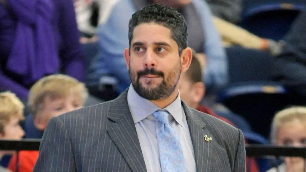 Former South Florida Bulls Head Coach Orlando Antigua looks on during a college basketball tournament game against the George Washington Colonials 