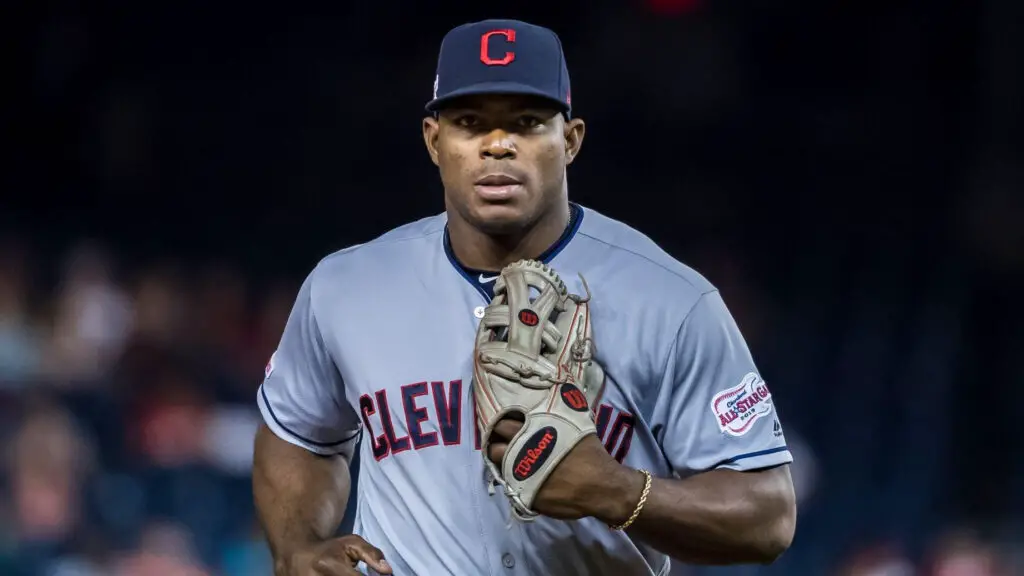 Former Cleveland Indians player Yasiel Puig returns to the dugout after fielding during the eighth inning against the Washington Nationals