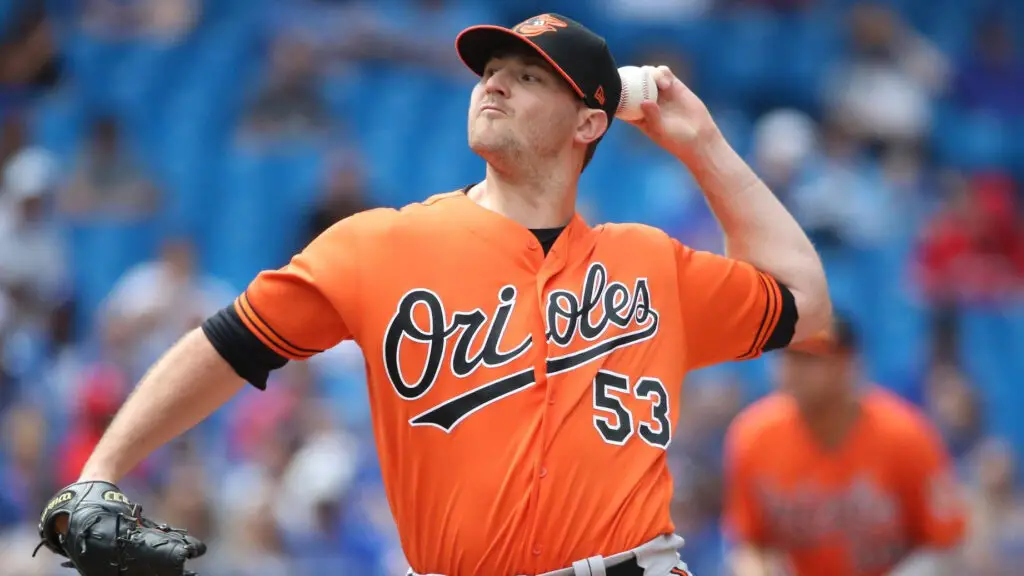 Former Baltimore Orioles pitcher Zach Britton delivers a pitch in the eighth inning during MLB game action against the Toronto Blue Jays