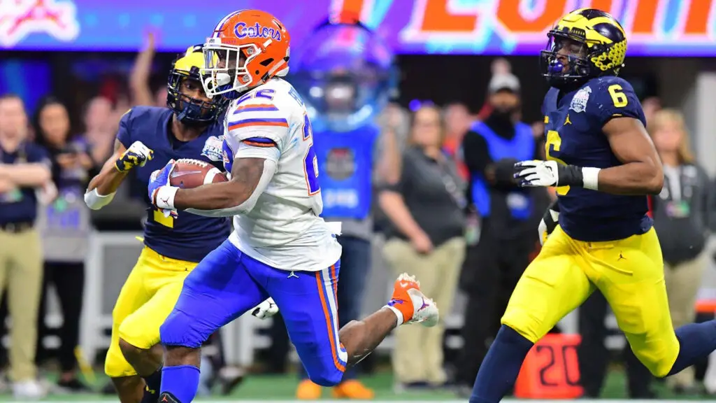 Florida Gators running back Lamical Perine runs in for a fourth-quarter touchdown against the Michigan Wolverines during the Chick-fil-A Peach Bowl