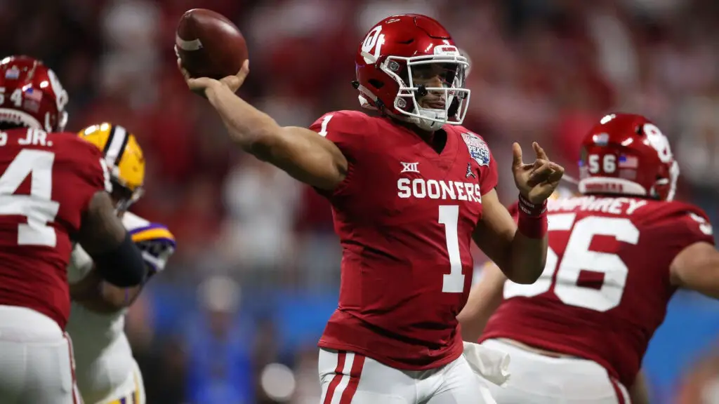 Former Oklahoma Sooners quarterback Jalen Hurts throws a pass against the LSU Tigers during the College Football Playoff Semifinal in the Chick-fil-A Peach Bowl 