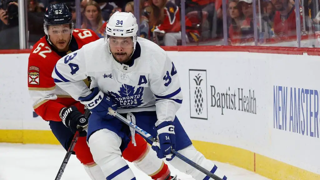 Toronto Maple Leafs star Auston Matthews skates with the puck against Brandon Montour against the Florida Panthers in Game Four of the 2023 Second Round playoff series 