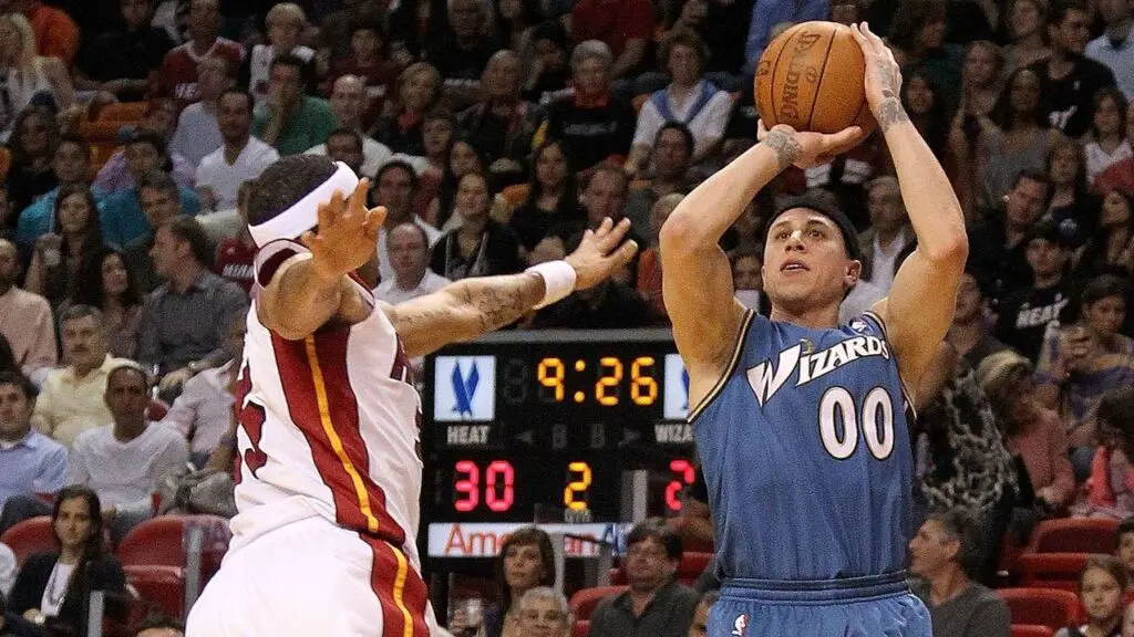 Washington Wizards guard Mike Bibby shoots over Eddie House against the Miami Heat during a game