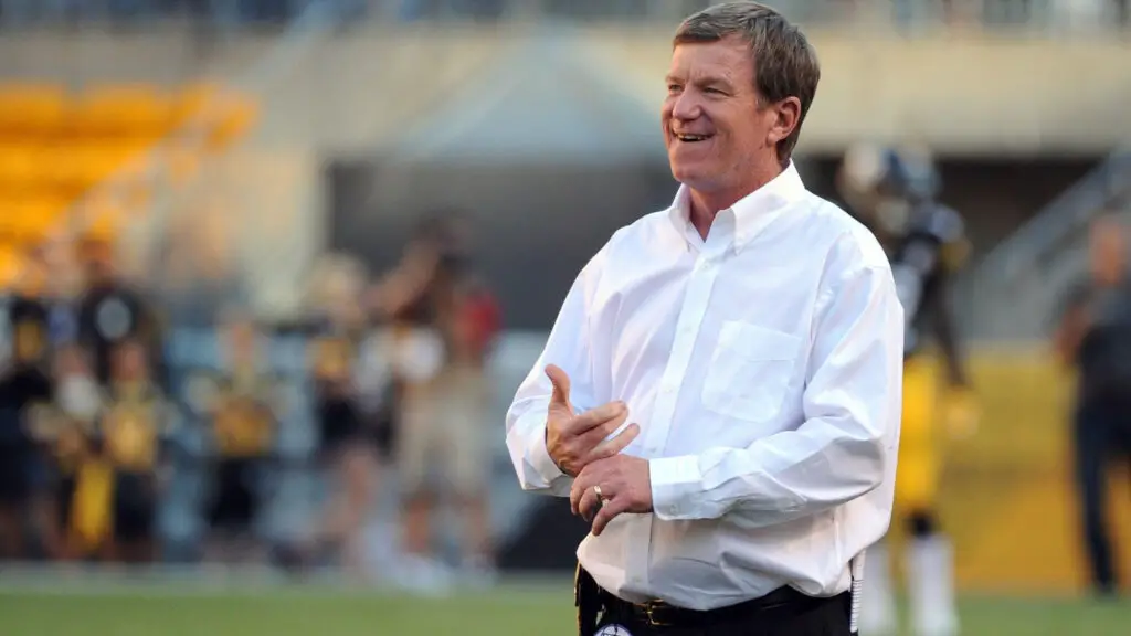 Former Carolina Panthers General Manager Marty Hurney looks on from the field before a preseason game against the Pittsburgh Steelers