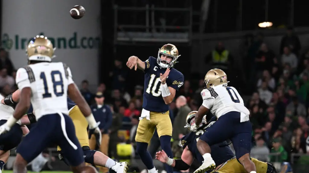 Notre Dame Fighting Irish quarterback Sam Hartman throws a pass against the Navy Midshipmen in the Aer Lingus College Football Classic Game