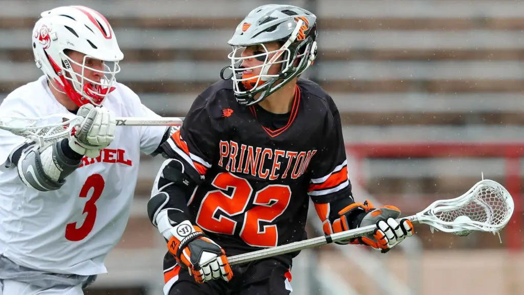 Former Princeton Tigers star Michael Sowers is being defended by Jonathan Donville against the Cornell Big Red during the first half
