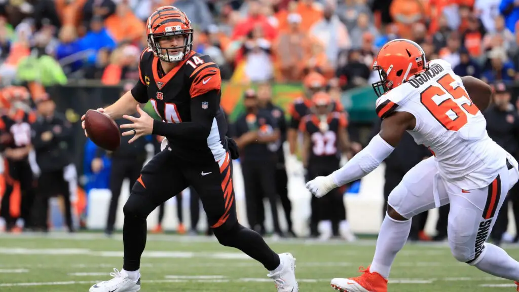 Former Cincinnati Bengals quarterback Andy Dalton runs with the football during the game against the Cleveland Browns