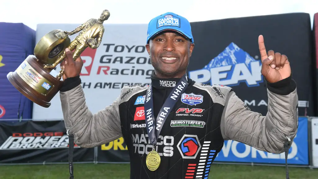AB Motorsports Top Fuel Dragster driver Antron Brown celebrates after winning his second straight U.S. Nationals after defeating Steve Torrence in the final round at Lucas Oil Indianapolis Raceway Park