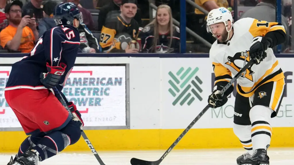 Former Pittsburgh Penguins player Josh Archibald plays the puck against the Columbus Blue Jackets during the first period