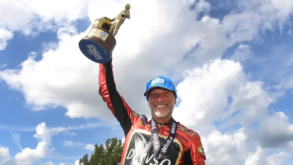 Denso sponsored Pro Stock Motorcycle rider Matt Smith celebrates his U.S. Nationals win over Hector Arana Jr. at the 69th annual Dodge Power Brokers NHRA U.S. Nationals
