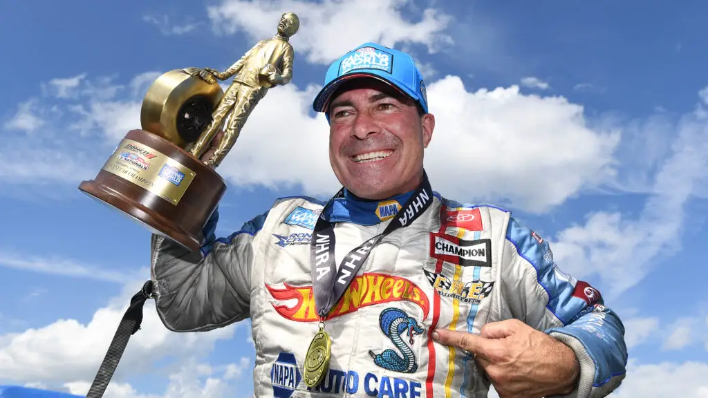 NAPA Auto Parts sponsored Funny Car driver Ron Capps celebrates his U.S. Nationals win over J.R. Todd at the 69th annual Dodge Power Brokers NHRA U.S. Nationals 