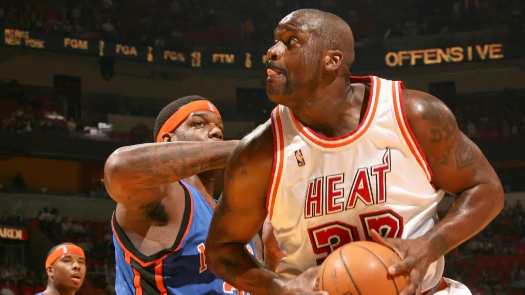 Former Miami Heat center Shaquille O’Neal drives to the basket against Eddy Curry against the New York Knicks