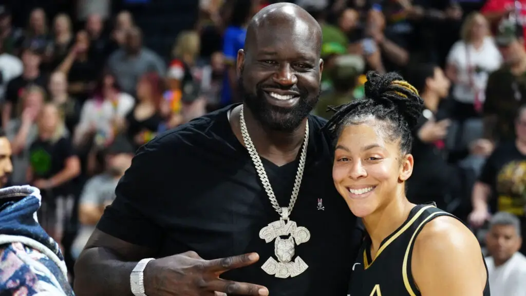 NBA Hall of Famer Shaquille O'Neal takes a picture with Las Vegas Aces star Candace Parker after the game against the Seattle Storm