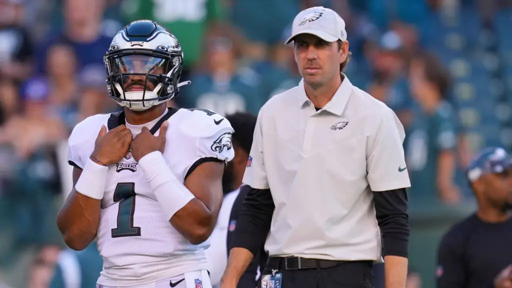 Former Philadelphia Eagles offensive coordinator Shane Steichen stands next to quarterback Jalen Hurts during a break in the action against the New York Jets during the preseason game