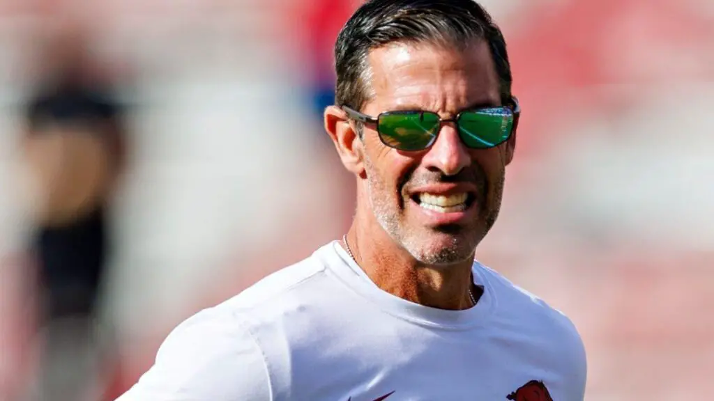 Former Arkansas Razorbacks offensive coordinator and quarterbacks coach Dan Enos is on the field before the game against the Mississippi State Bulldogs