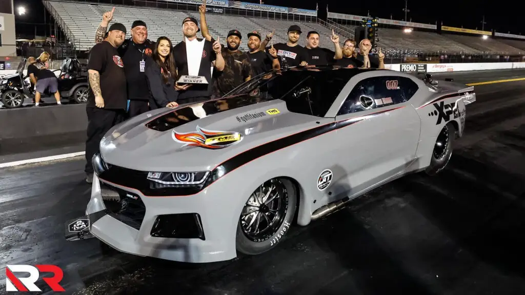 Street Outlaws No Prep Kings driver Ryan Martin and his team celebrate their Street Outlaws No Prep Kings win