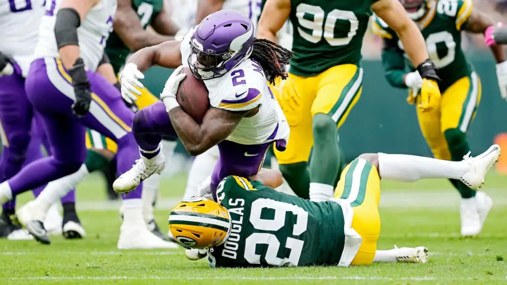 Former Green Bay Packers defensive back Rasul Douglas attempts to tackle Minnesota Vikings running back Alexander Mattison as he runs with the ball in the fourth quarter