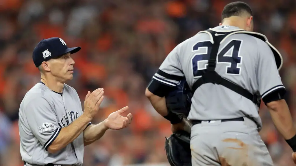 Former New York Yankees manager Joe Girardi walks to the mound to relieve CC Sabathia in the fourth inning against the Houston Astros in Game Seven of the American League Championship Series