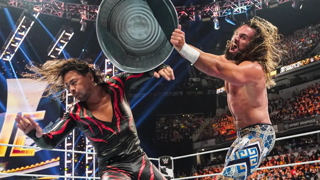 WWE Superstar Seth “Freakin’” Rollins hits Shinsuke Nakamura with a trash can in a Last Man Standing Man at the Fastlane Pay-Per-View