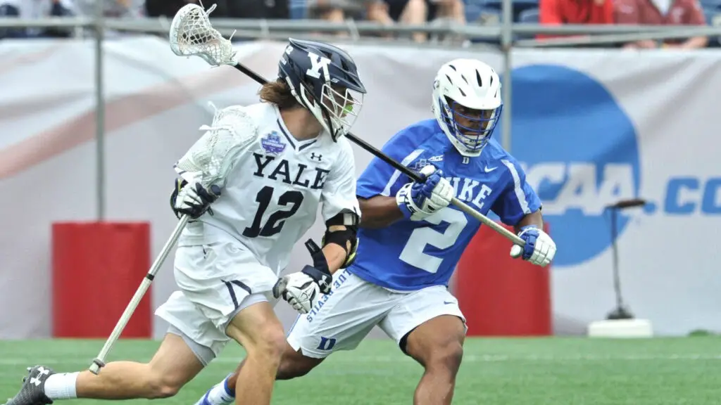 Yale Bulldogs player Brian Tevlin tries to get around Duke Blue Devils defensive player JT Giles-Harris during the Men's Lacrosse Championship