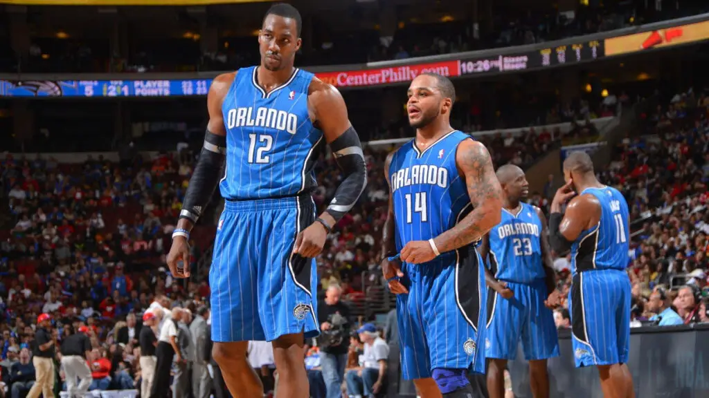 Former Orlando Magic center Dwight Howard speaks with teammate Jameer Nelson during the game against the Philadelphia 76ers