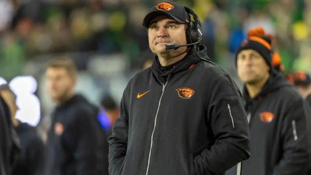 Former Oregon State Beavers head coach Jonathan Smith stands on the field during the first half against the Oregon Ducks