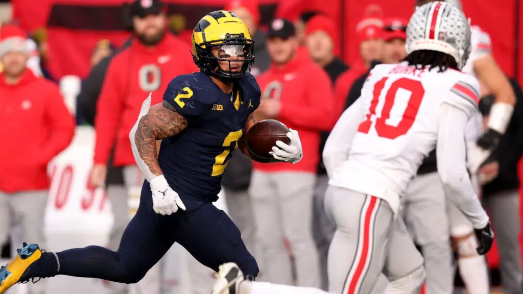 Michigan Wolverines running back Blake Corum runs the ball against the Ohio State Buckeyes during the second half in the game