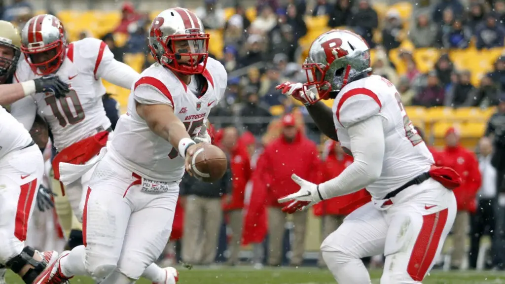 Rutgers Scarlet Knights quarterback Gary Nova hands off the football to Jawan Jamison against the Pittsburgh Panthers during the game