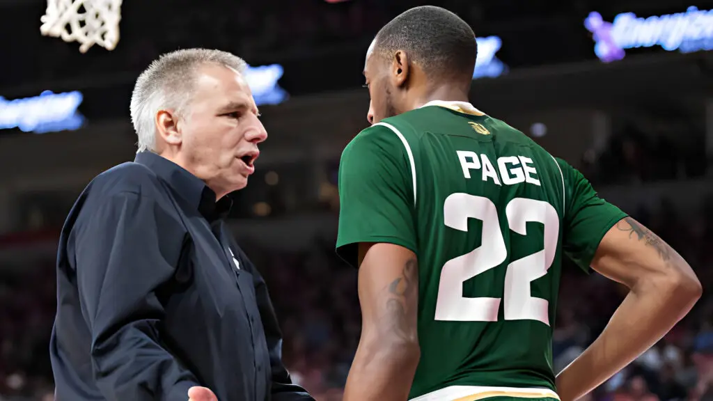 Colorado State Rams men’s basketball head coach Larry Eustachy talks with J.D. Paige during a game against the Arkansas Razorbacks