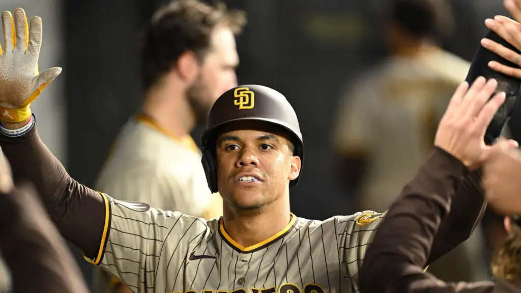 Former San Diego Padres star Juan Soto celebrates with teammates in the dugout after scoring in the second inning against the Chicago White Sox