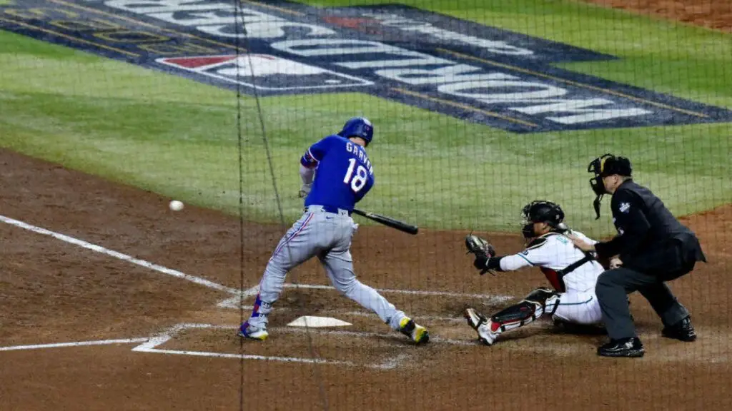 Former Texas Rangers player Mitch Garver hits an RBI single in the seventh inning during Game 5 of the 2023 World Series between the Texas Rangers and the Arizona Diamondbacks