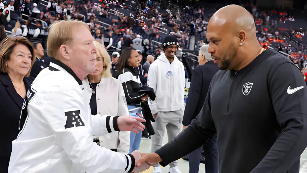 Las Vegas Raiders Owner and Managing General Partner Mark Davis shakes hands with interim head coach Antonio Pierce on the Raiders' sideline before the team's game against the Denver Broncos