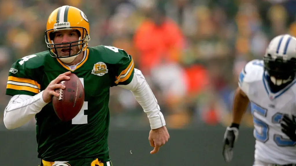 Green Bay Packers quarterback Brett Favre is chased out of the pocket by Detroit Lions defensive player Paris Lenon