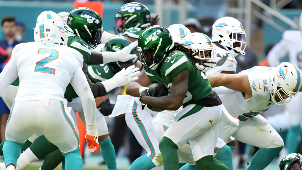 New York Jets running back Dalvin Cook runs the ball against the Miami Dolphins during the first half