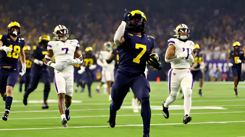 Michigan Wolverines running back Donovan Edwards rushes for his second touchdown of the first half against the Washington Huskies during the 2024 CFP National Championship game