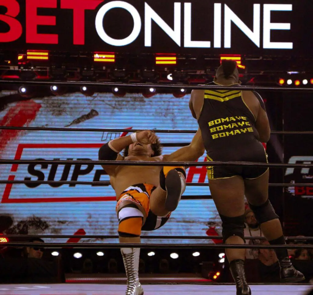 Major League Wrestling fighter Alex Kane clotheslines Satoshi Kojima during their match