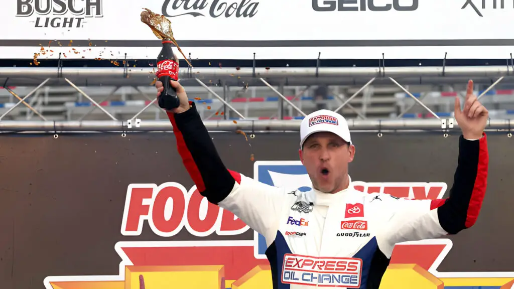 Joe Gibbs Racing driver Denny Hamlin celebrates in victory lane after winning the NASCAR Cup Series Food City 500