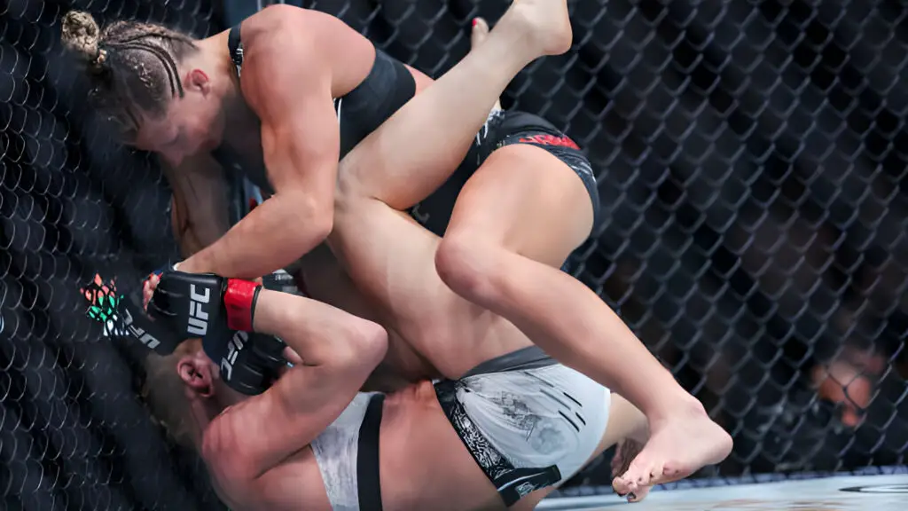 UFC stars Holly Holm and Kayla Harrison grapple during their bantamweight fight
