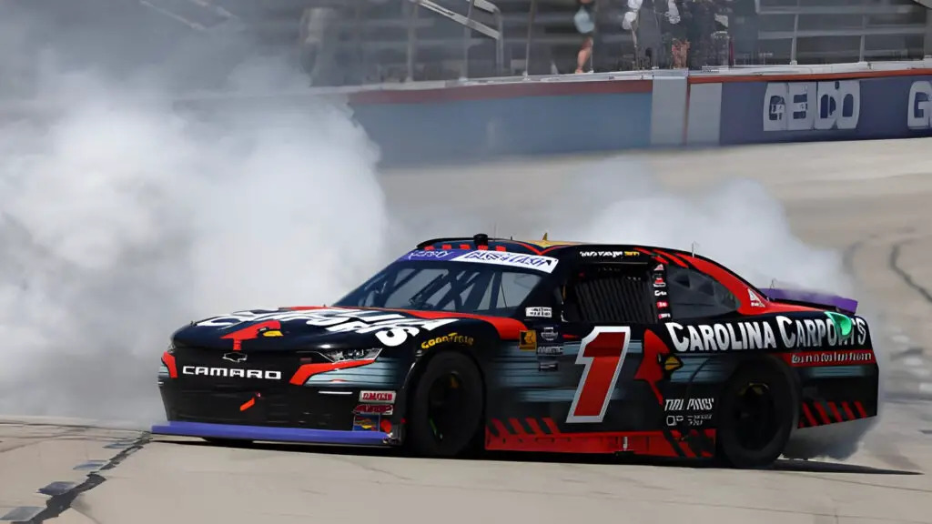 Carolina Carports sponsored driver Sam Mayer celebrates with a burnout after winning the NASCAR Xfinity Series Andy's Frozen Custard 300